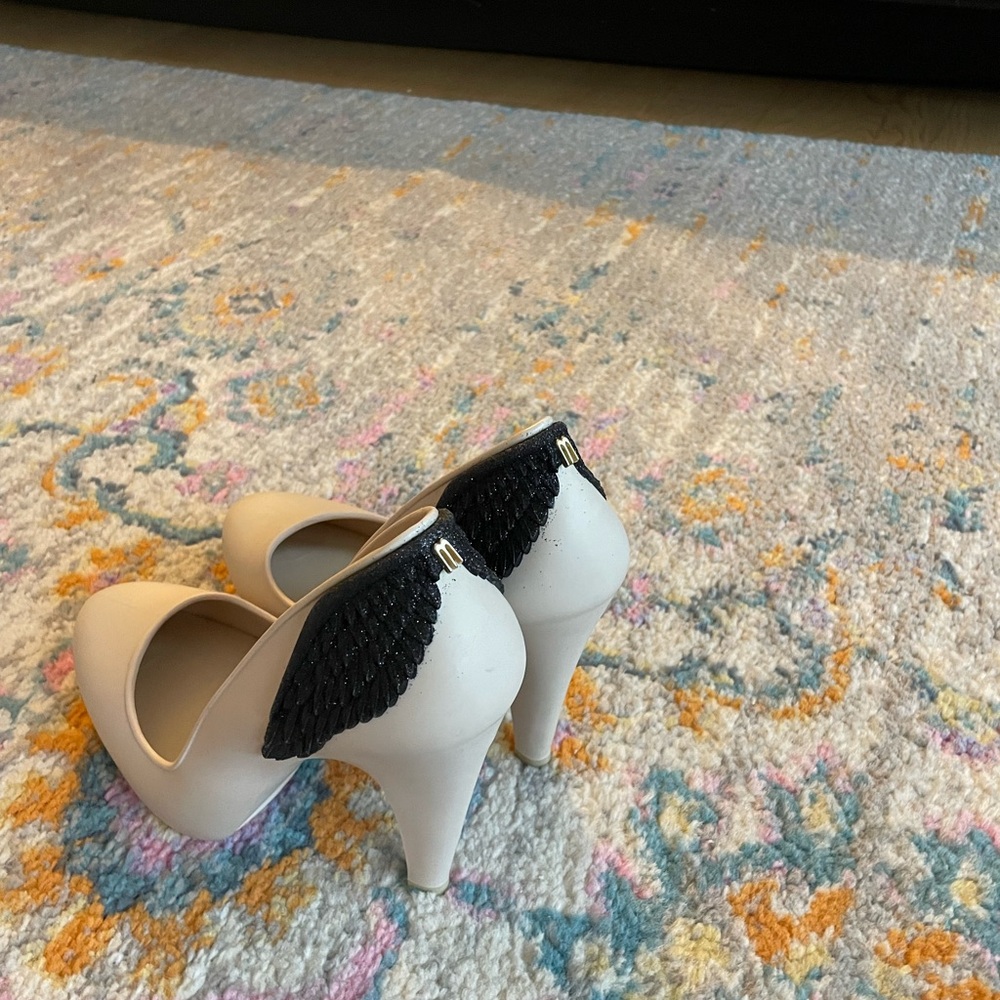 Melissa Vivienne Westwood Cream Heels with Black Glitter Wing Accent